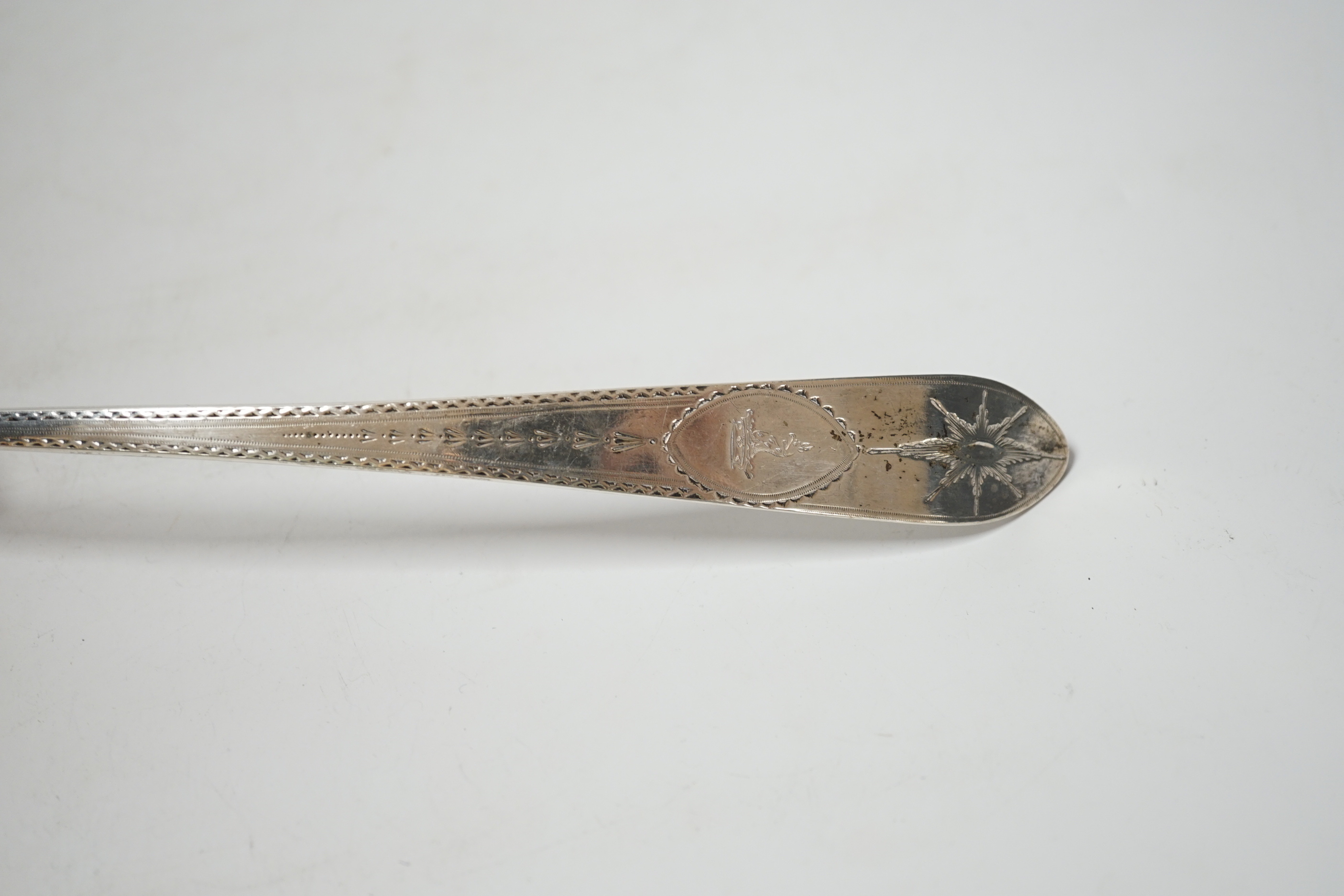 A George III Irish engraved silver soup ladle, John Shiels?, Dublin, 1793, 36cm, with fluted bowl